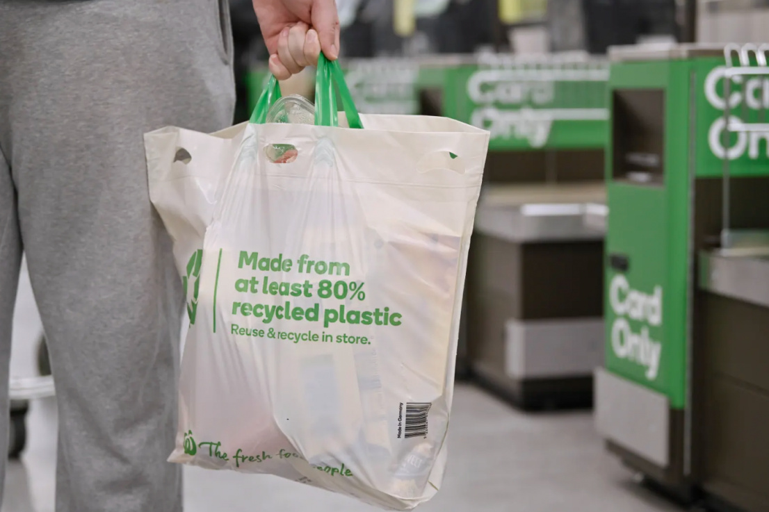 Woolworths and Big W will phase out reusable plastic bags by June next year.
