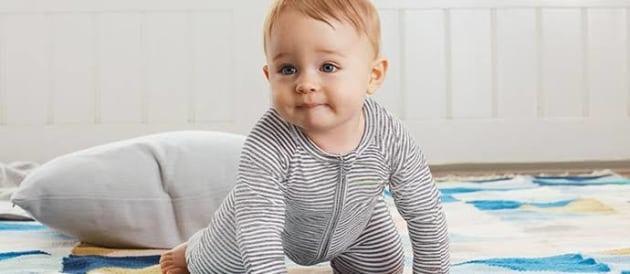 Baby in grey jumpsuit
