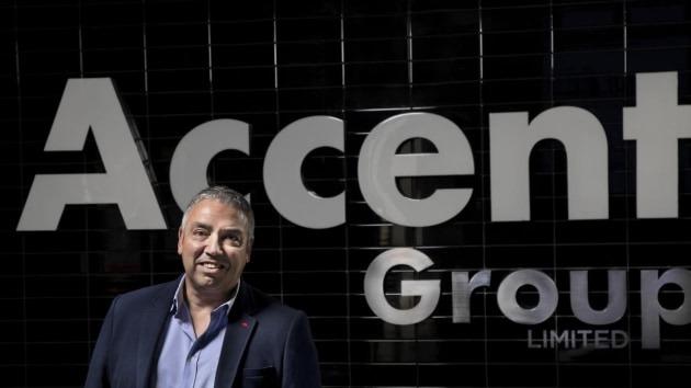 Accent group sign with man in front