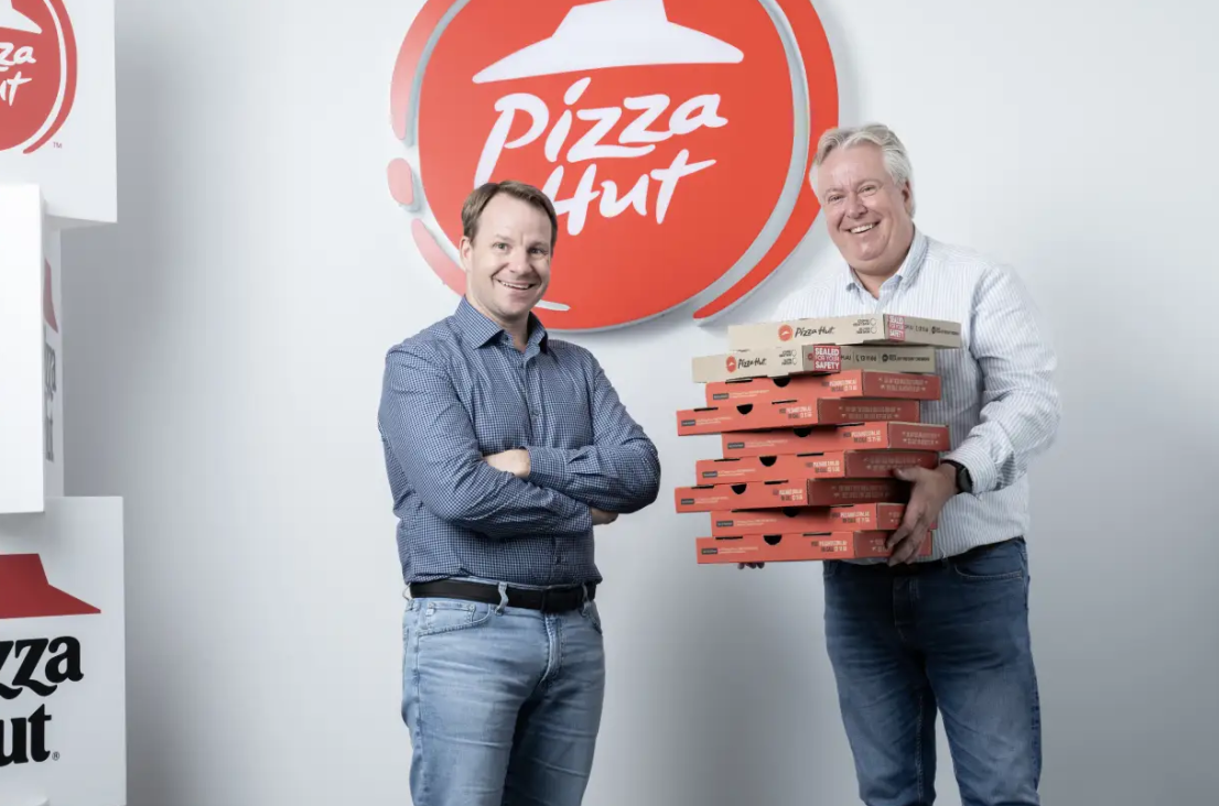 Flynn Restaurant Group chief operating officer Ron Bellamy (left) with Pizza Hut Australia CEO Phil Reed.  Louie Douvis
